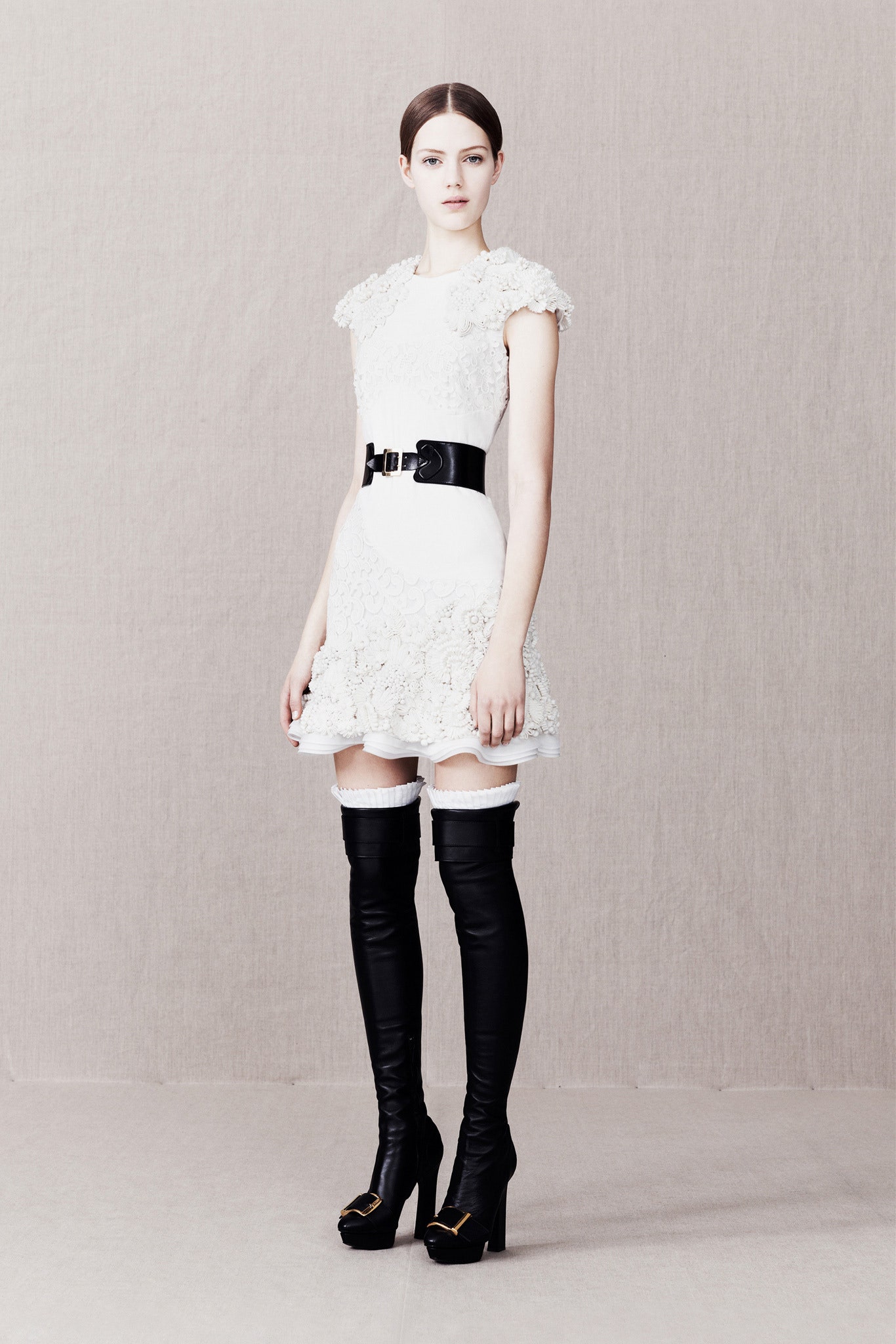 white cotton sleeveless high-neck fitted ruffled mini dress