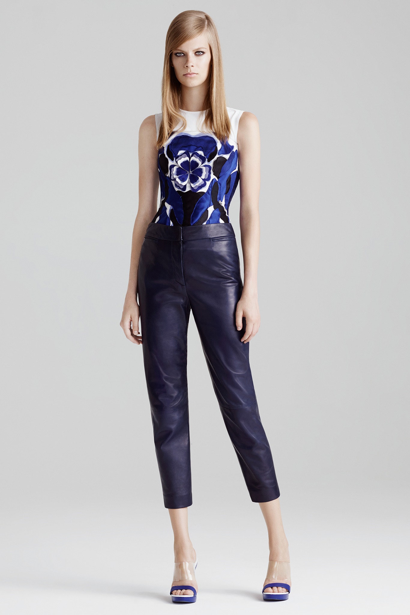 fitted white blue embroidered top and black leather pants