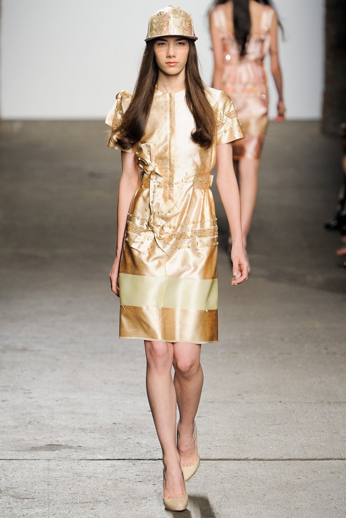 gold silk fitted dress with hat