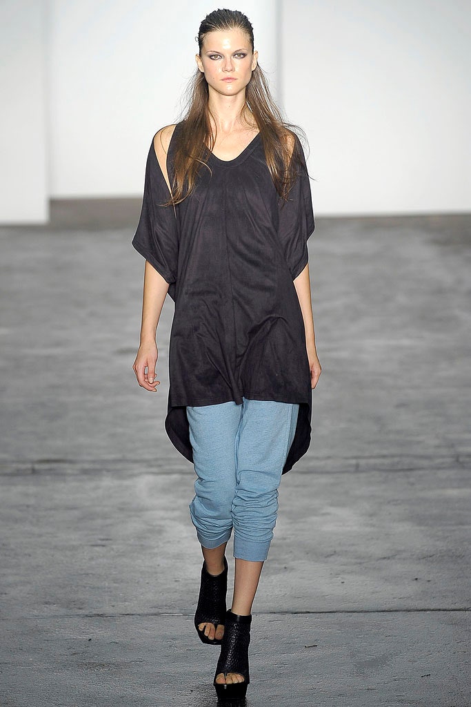 black relaxed top with blue pants