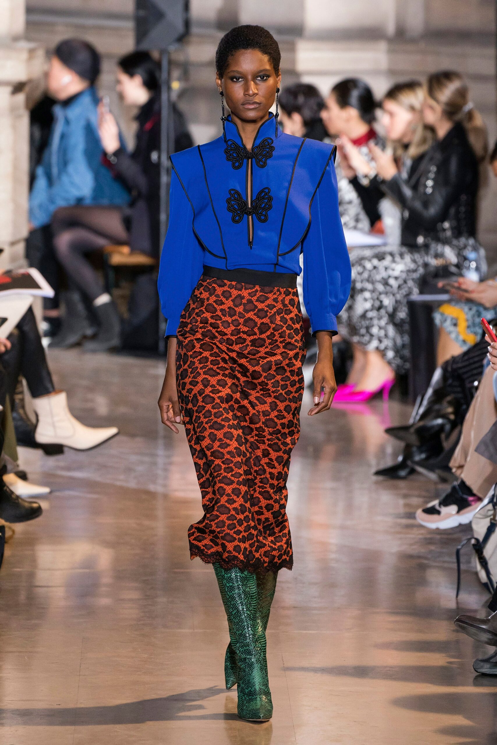 blue blouse orange animal-print skirt