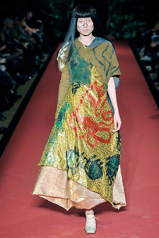 gold and green layered dress with poncho