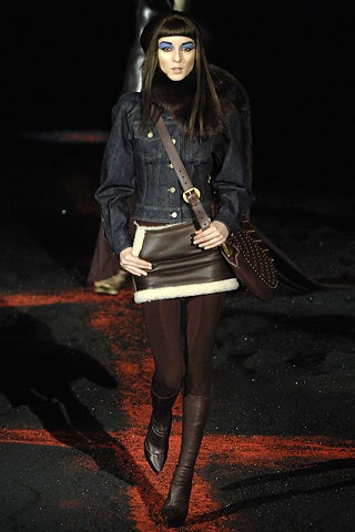 blue denim jacket with brown leather skirt