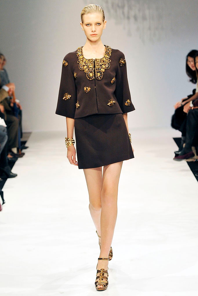 brown embroidered jacket and mini skirt