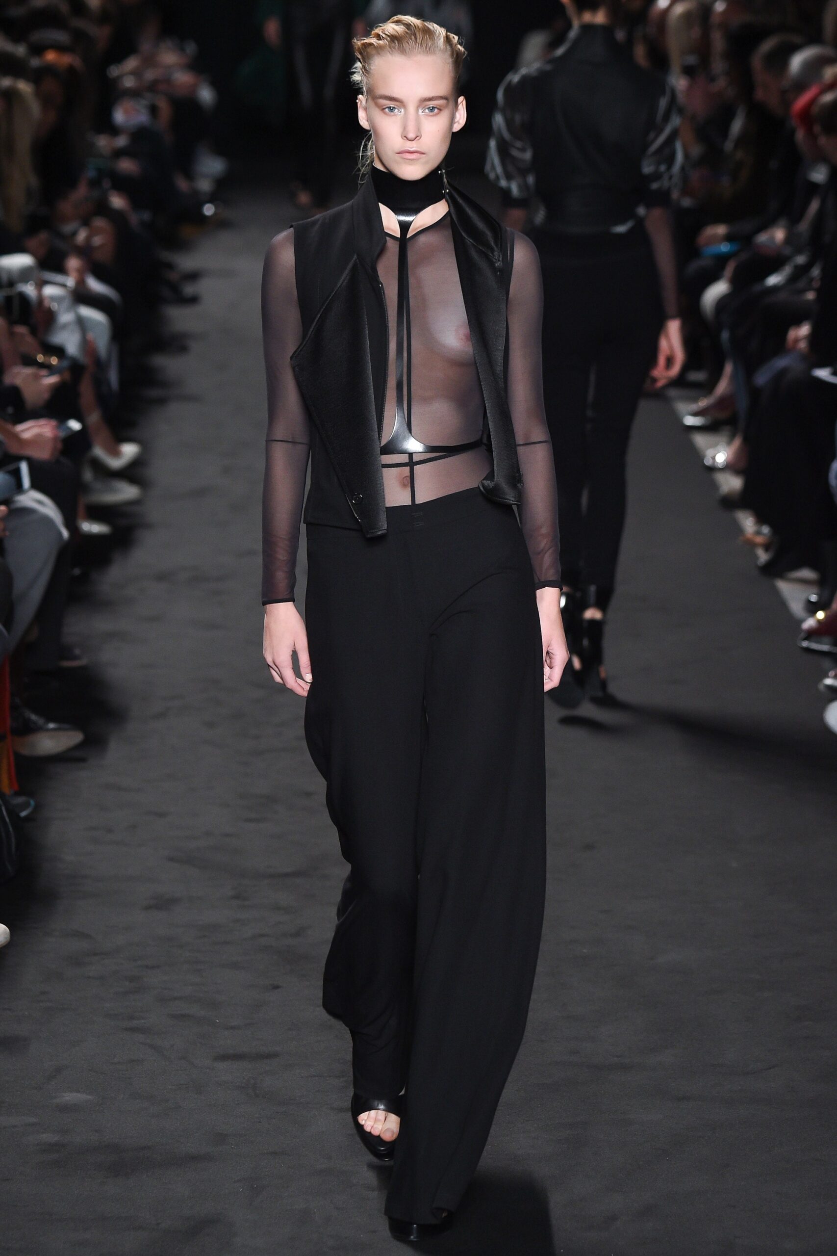 black sheer top and relaxed pants