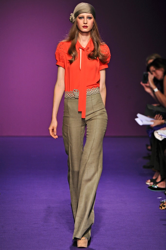 red fitted top with flared pants