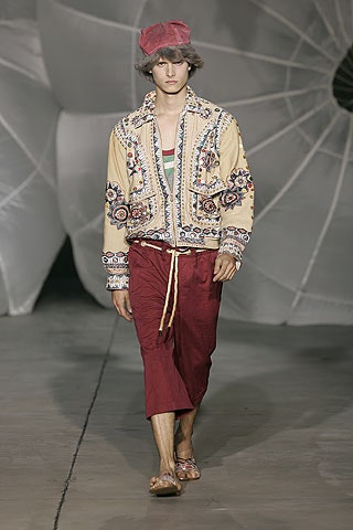 beige embroidered jacket with red pants