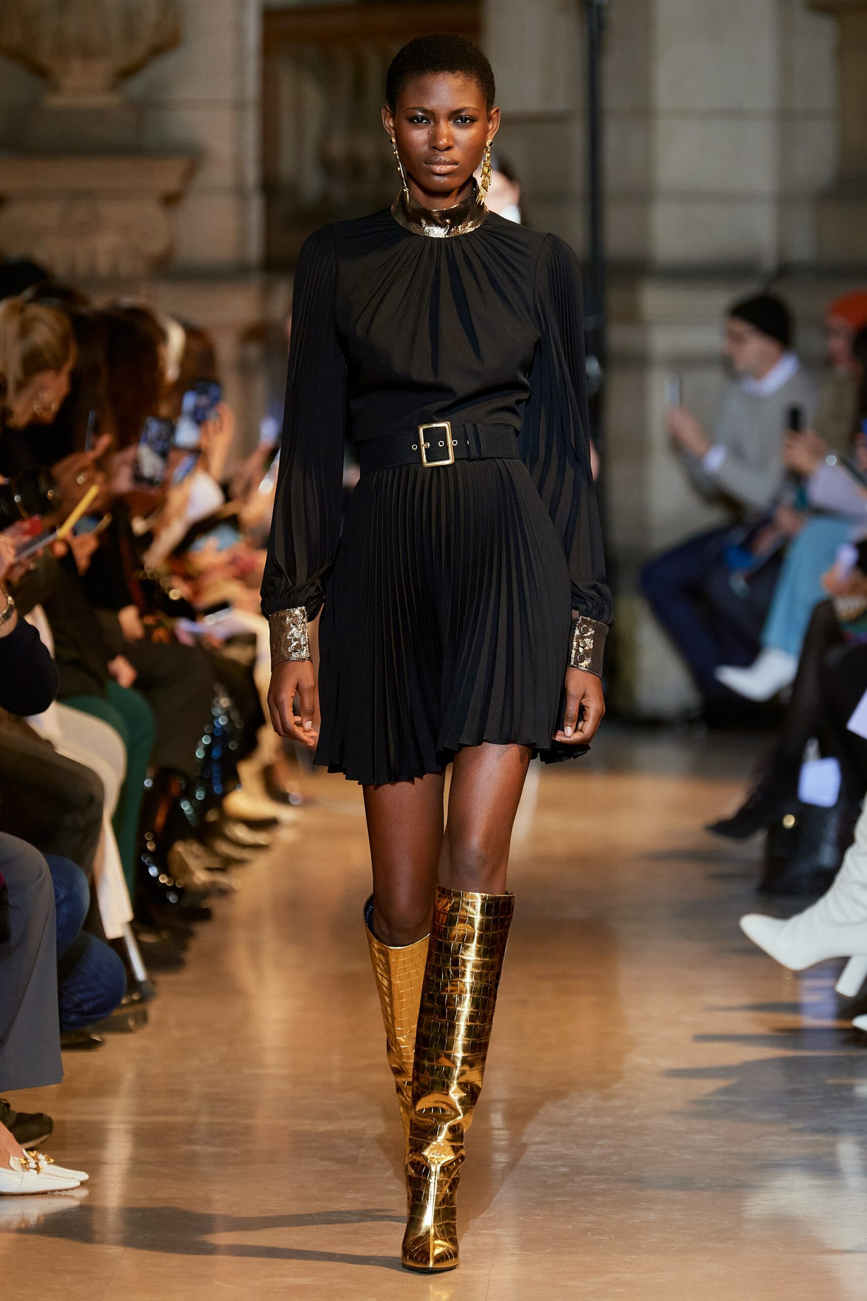 black pleated mini dress with gold boots