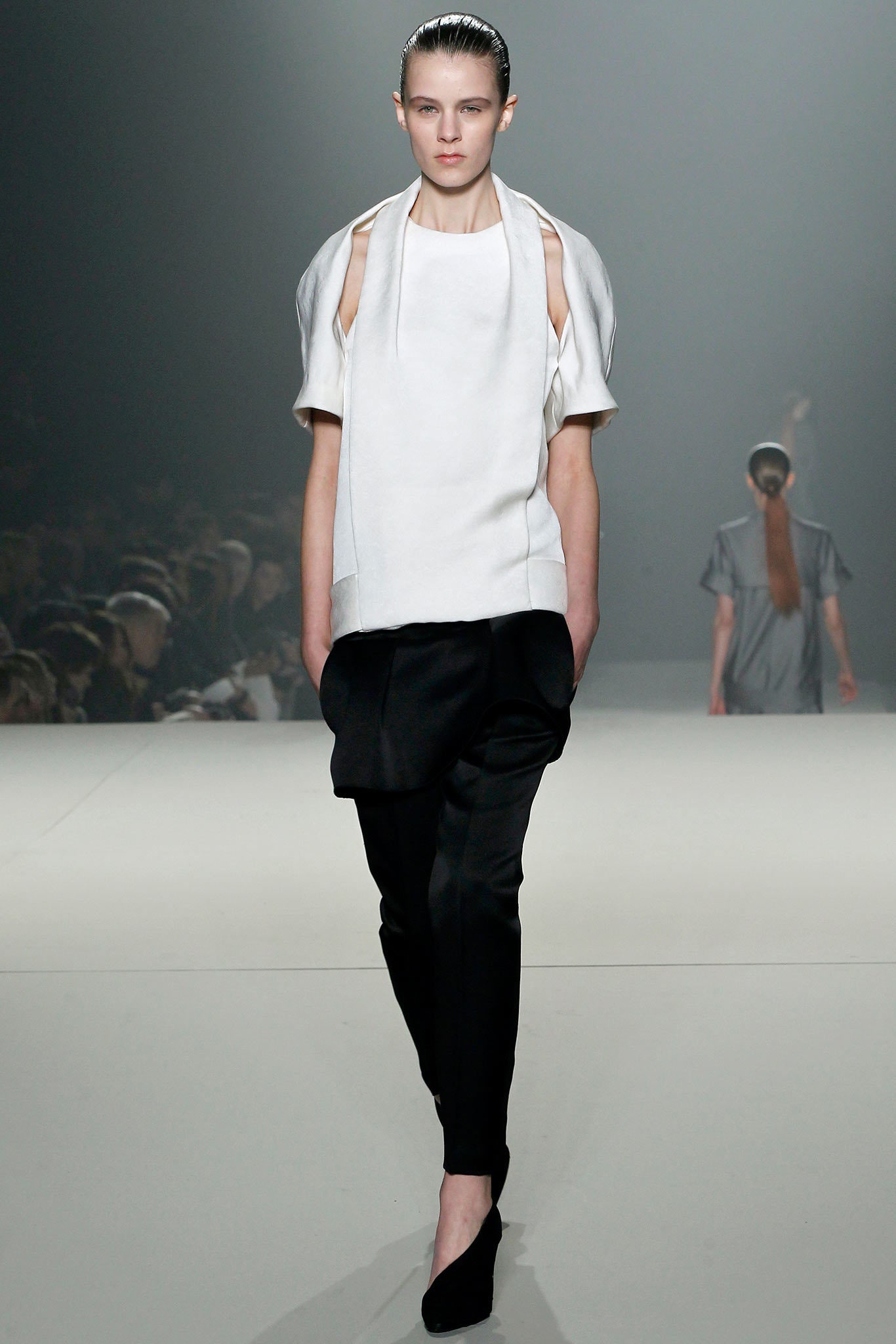 white relaxed top and black pants
