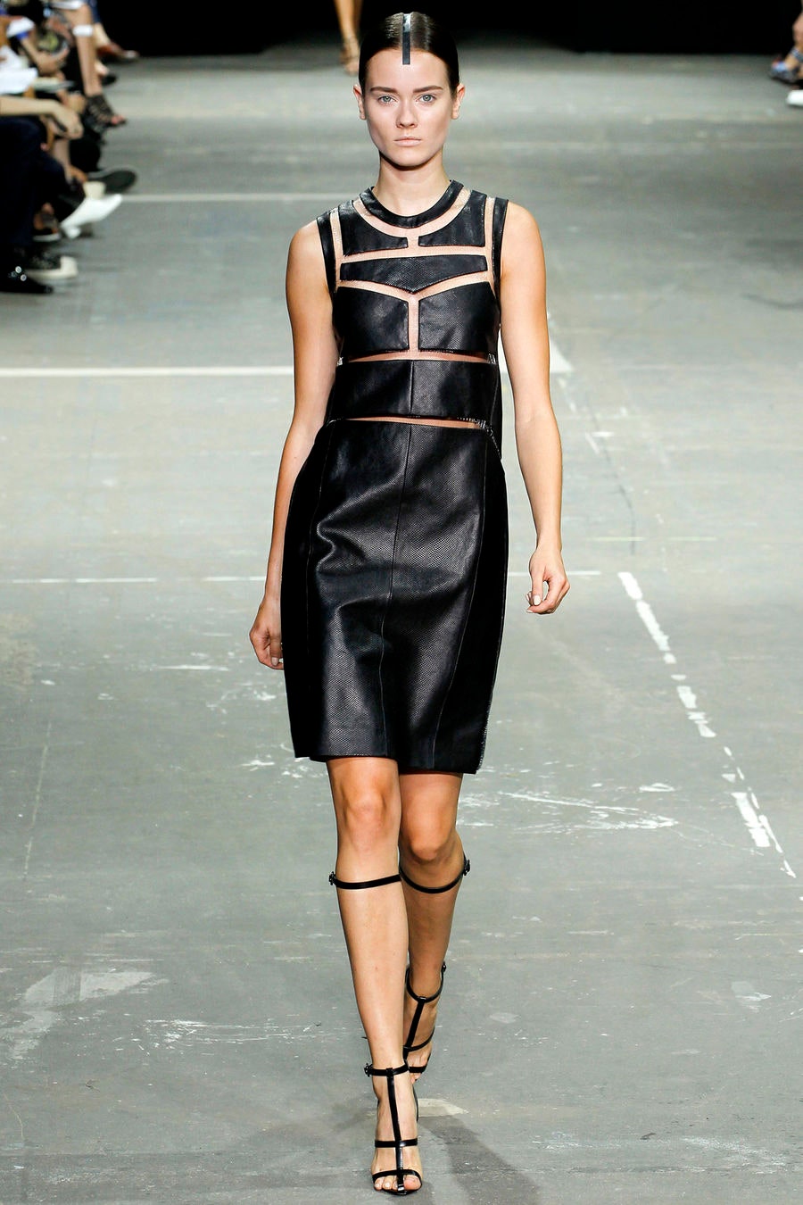 black leather fitted dress and strappy shoes