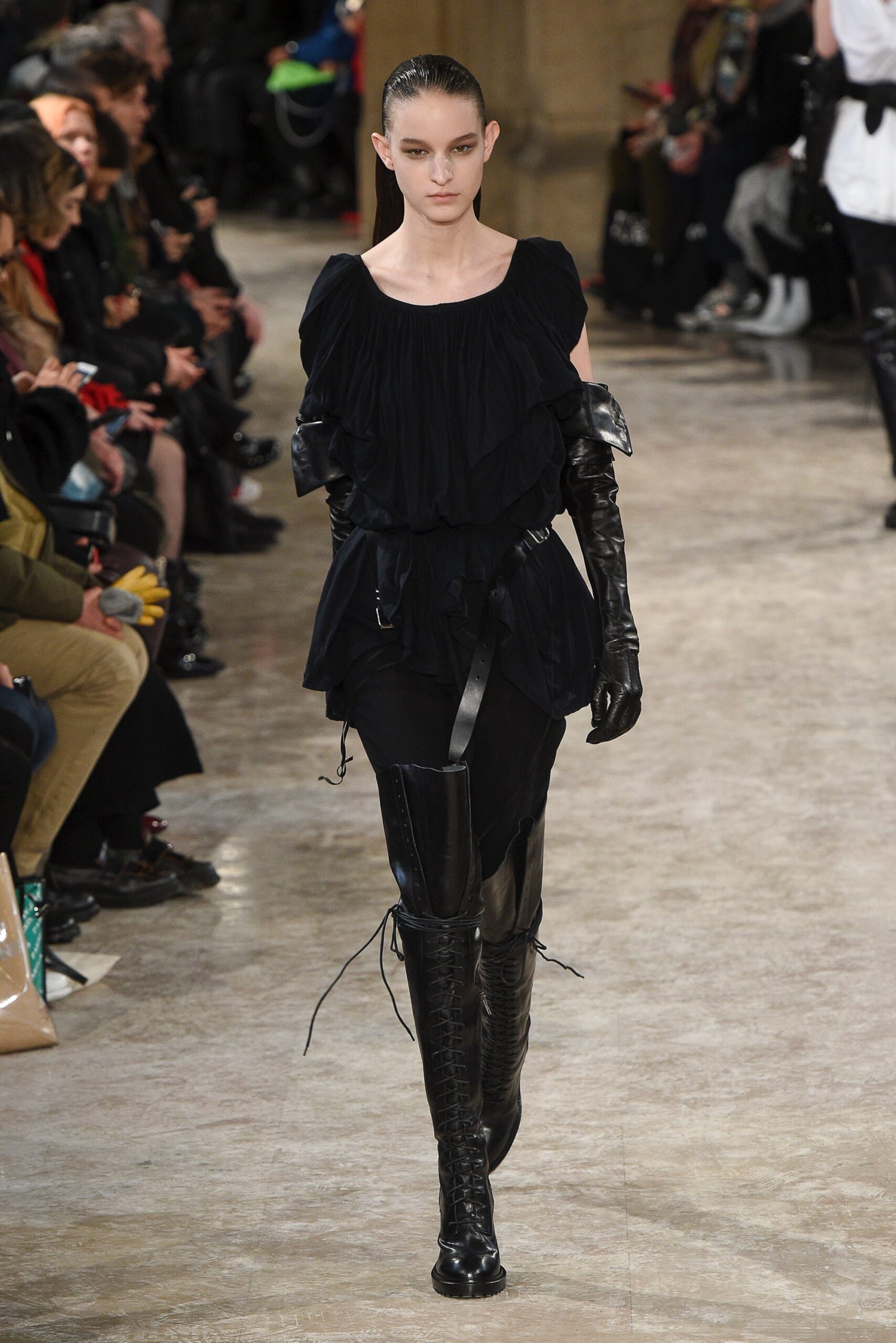 black ruffled top with leather pants
