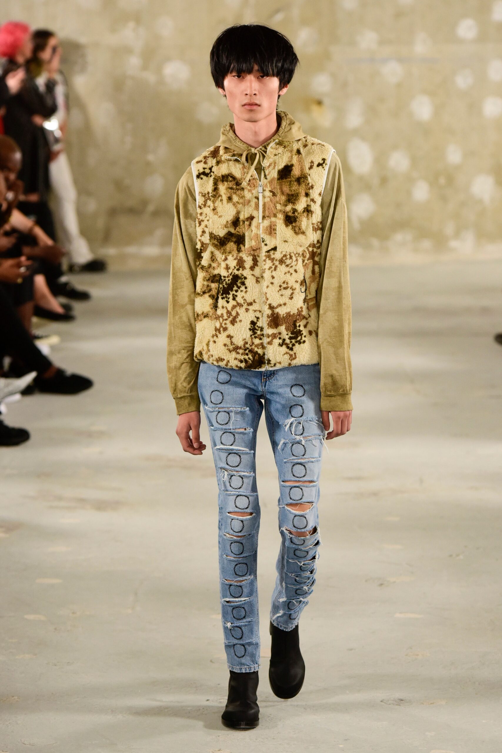 green printed hoodie and blue distressed pants