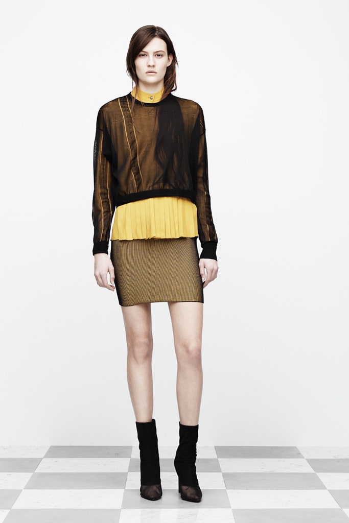 black sheer top with yellow skirt