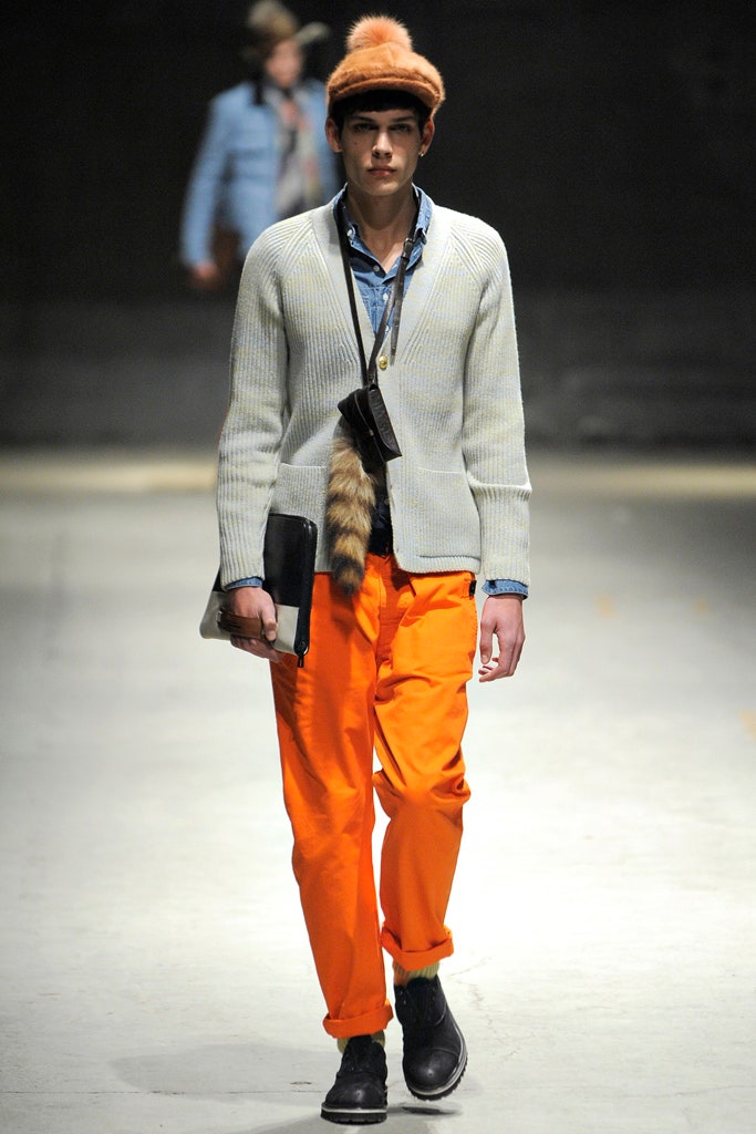 white fitted sweater with orange pants