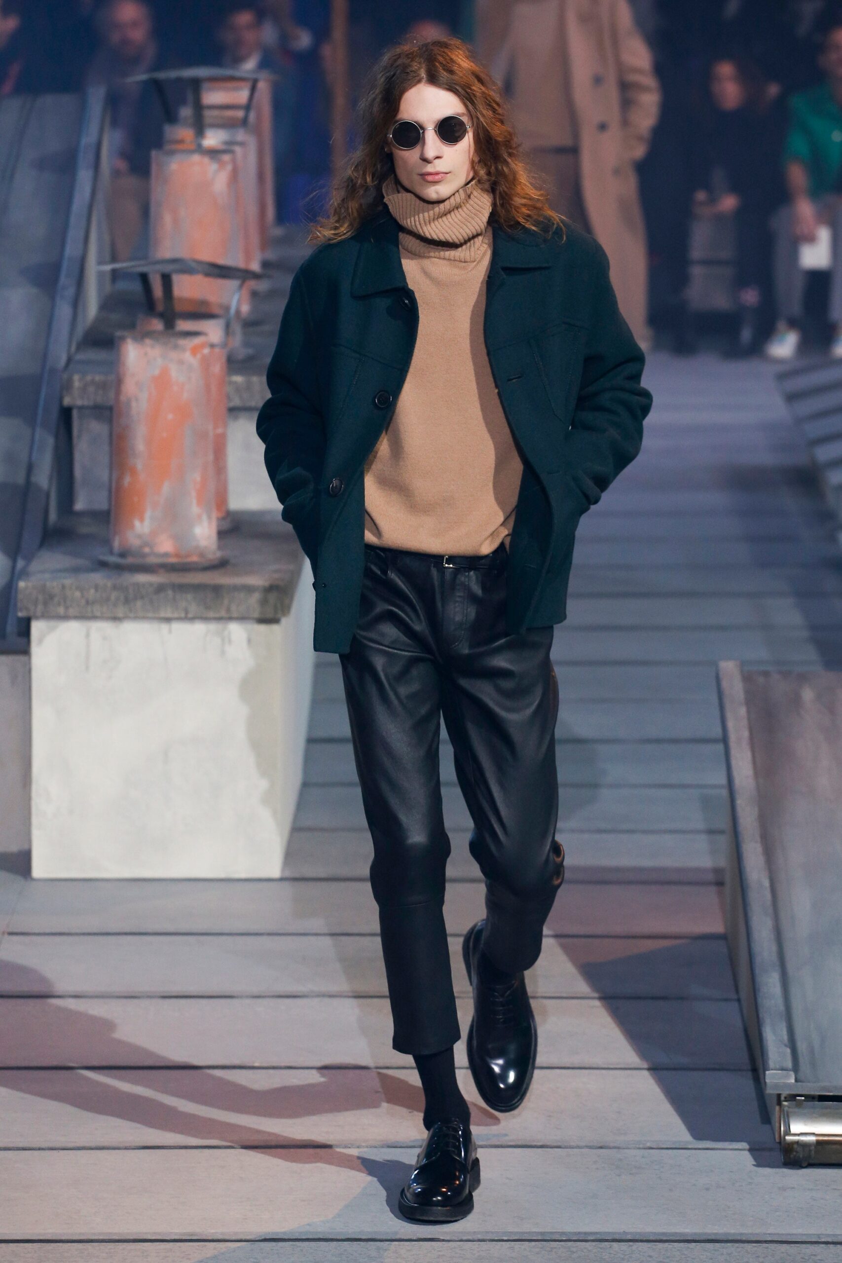 green wool coat beige turtleneck black leather pants