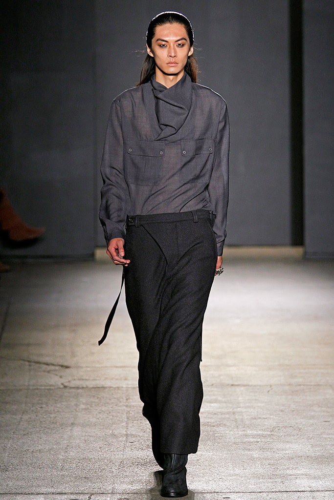 gray shirt and black pants