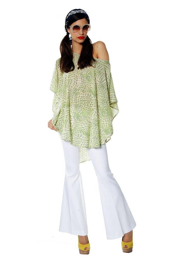 green off-shoulder top with flared pants