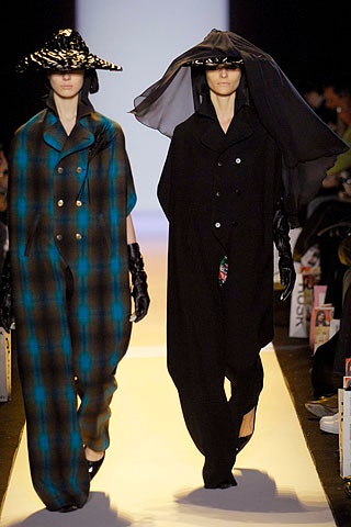 blue checked jumpsuit and black coat