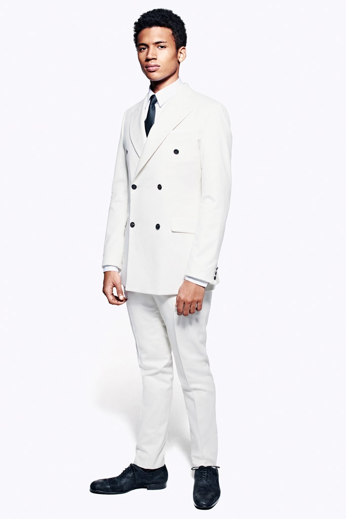 white tailored suit with black shoes