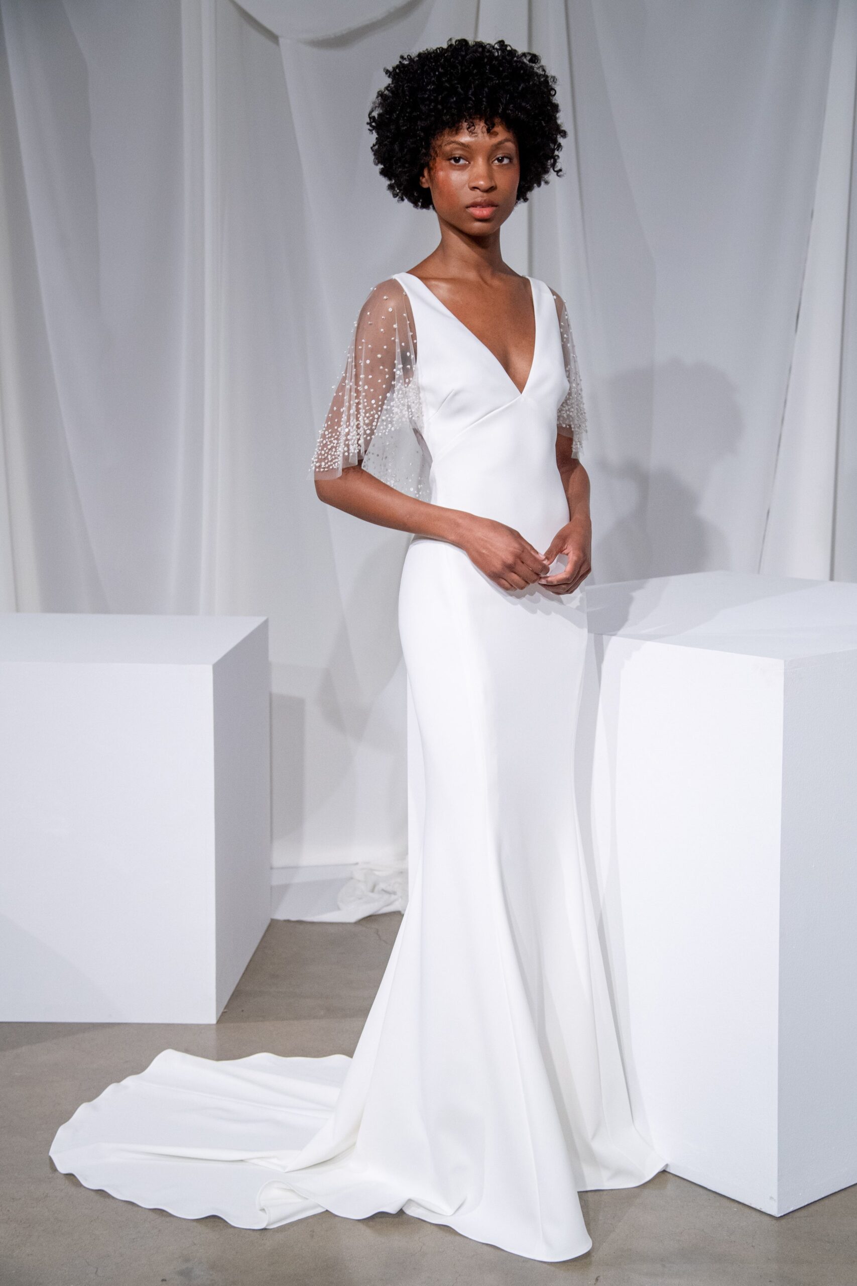 white fitted v-neck gown
