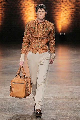 embroidered orange shirt with tailored pants
