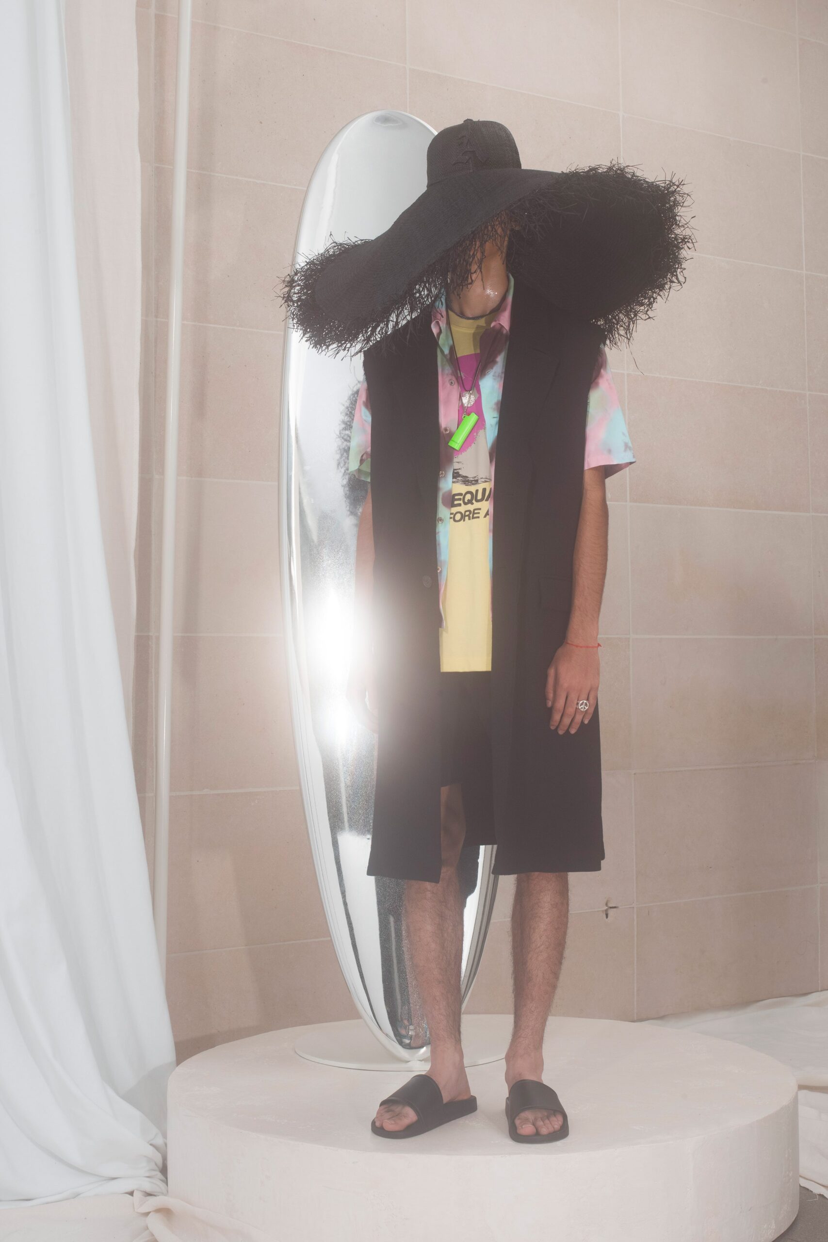 black vest with multi-colored shirt