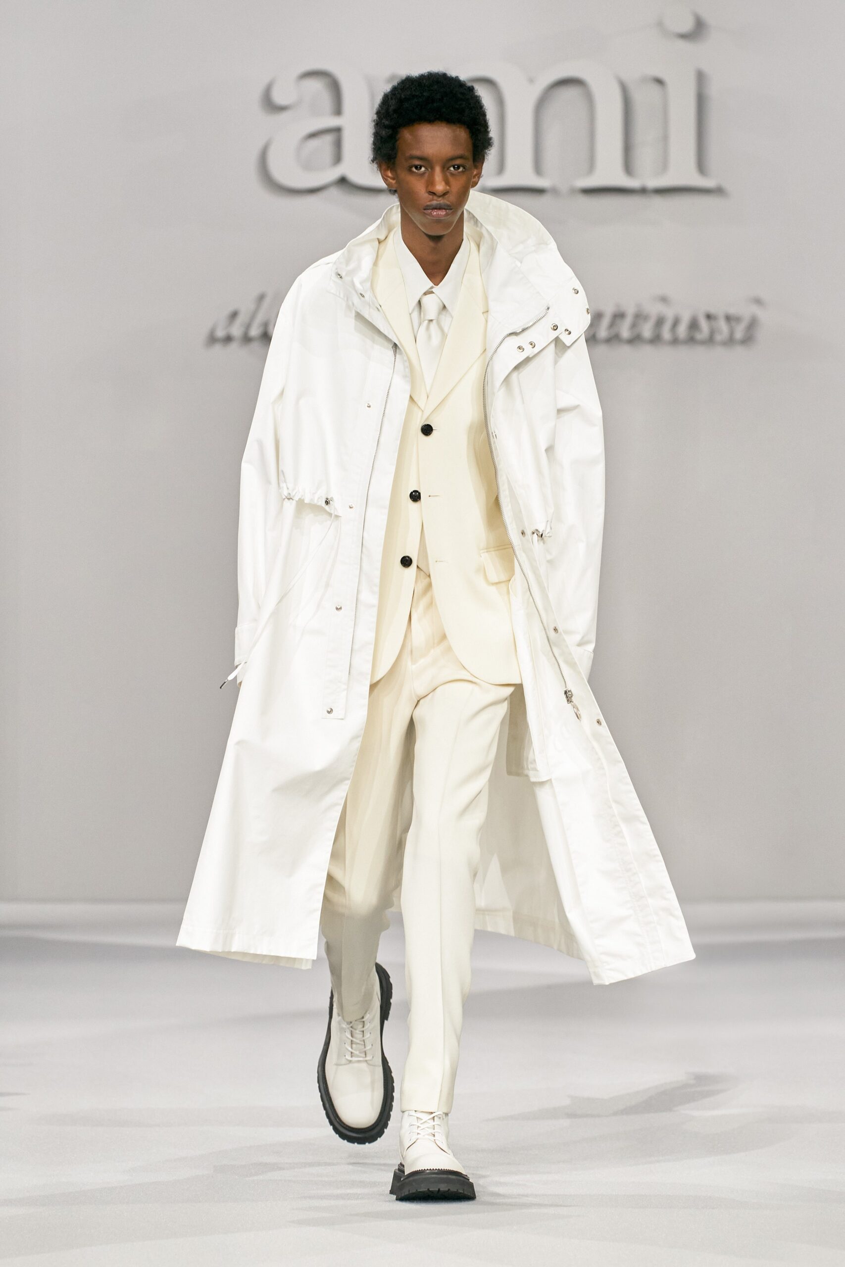 white coat and suit ensemble