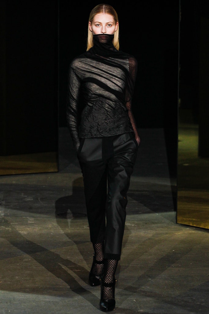 black fitted top and tailored pants