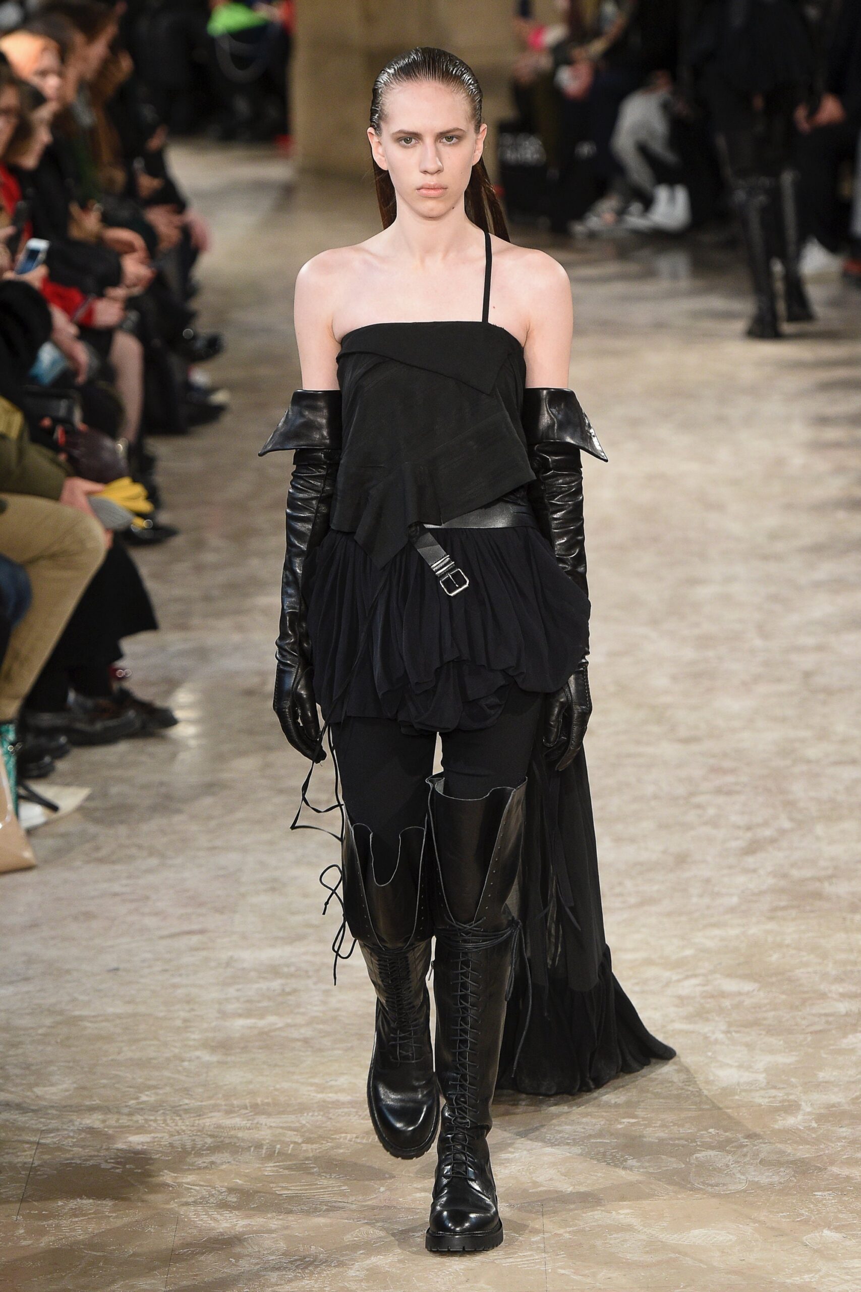 black asymmetric top with fitted pants