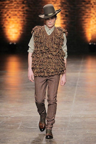 brown fur vest with gray shirt