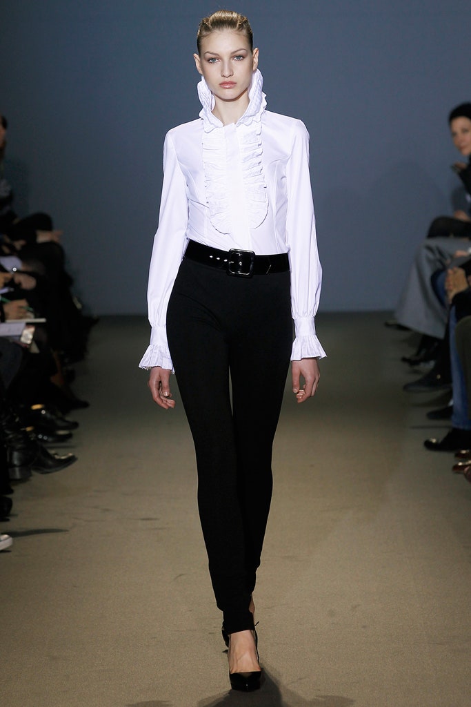 white ruffled blouse and black pants