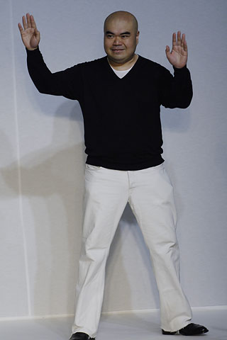 black sweater and white pants