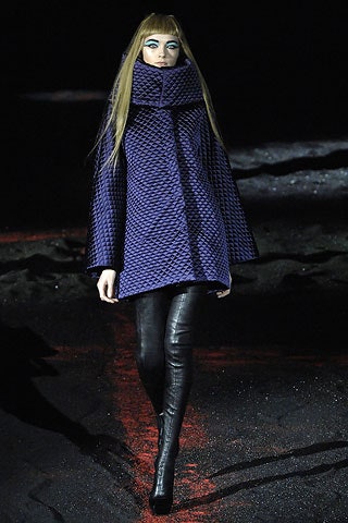 purple quilted coat with black leather pants