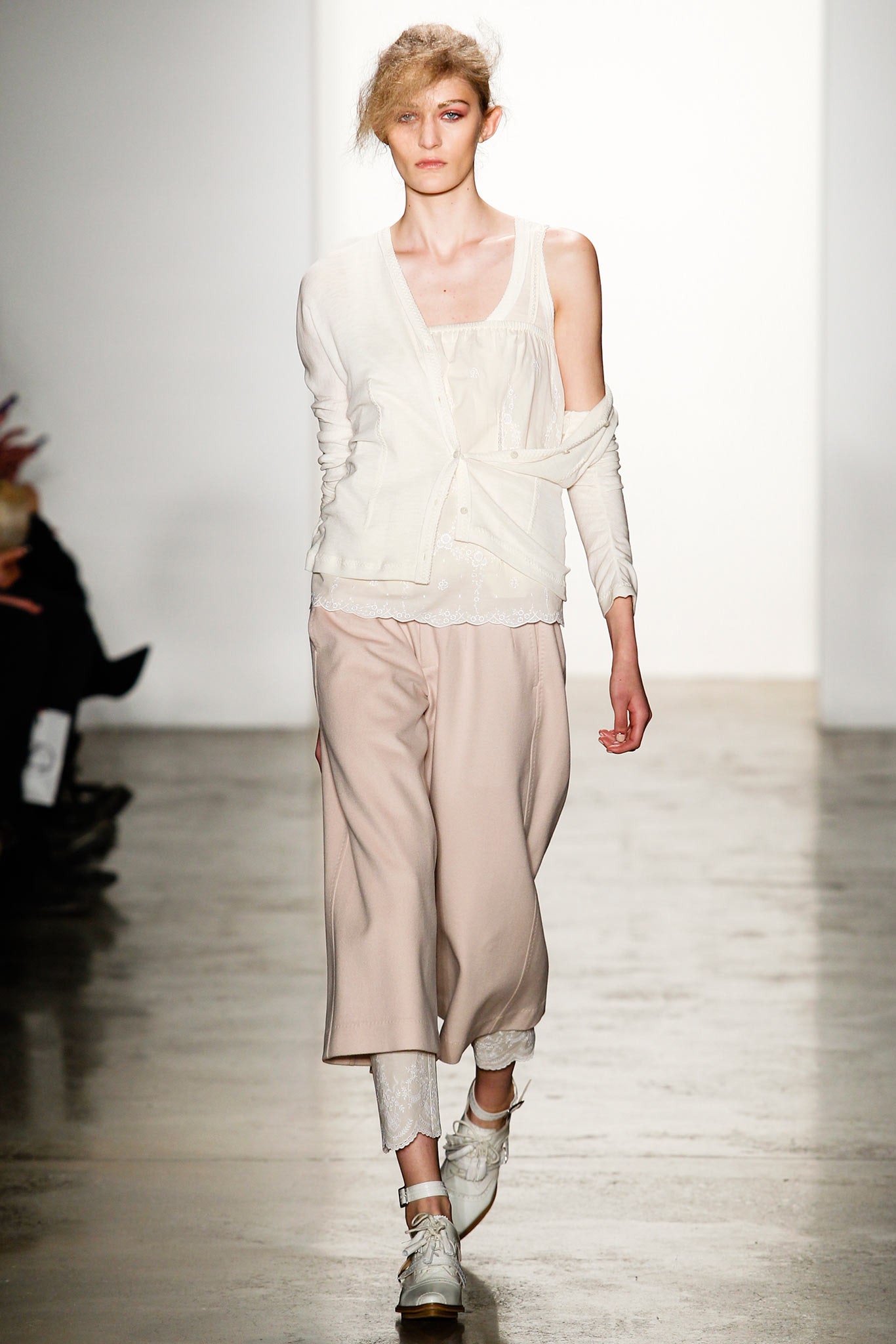 white relaxed top with beige pants