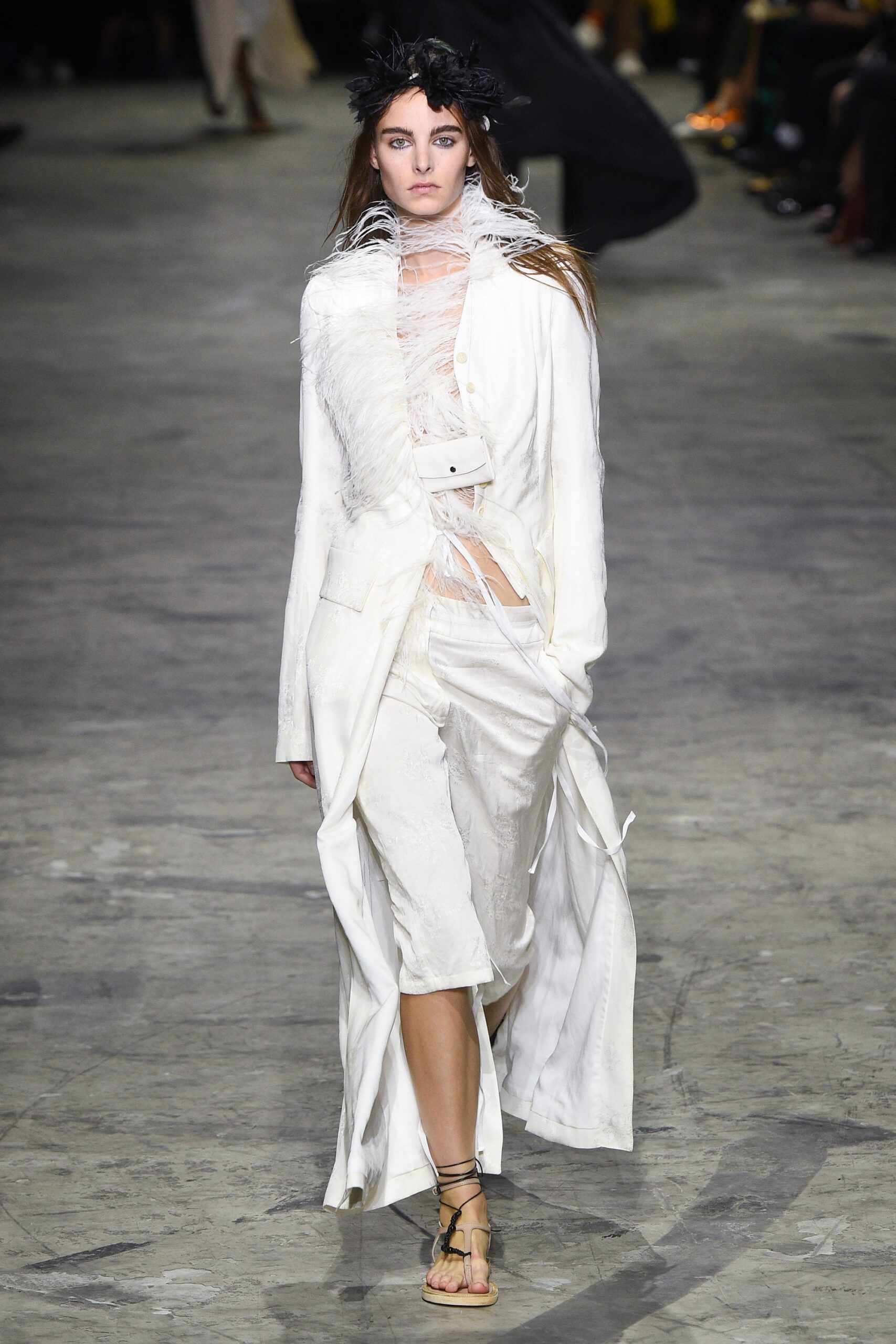 white fitted coat and relaxed pants