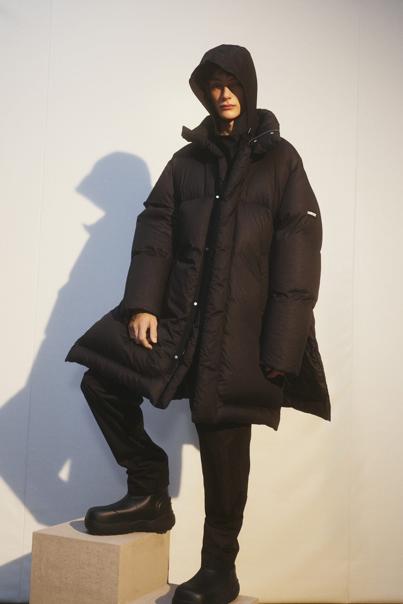 oversized black coat with relaxed pants