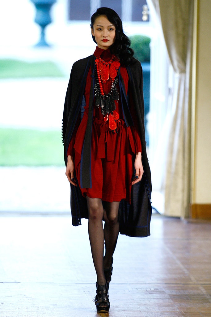 red silk mini dress with black cape