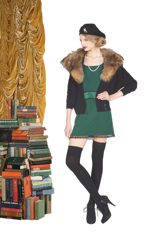 green fitted dress with black coat