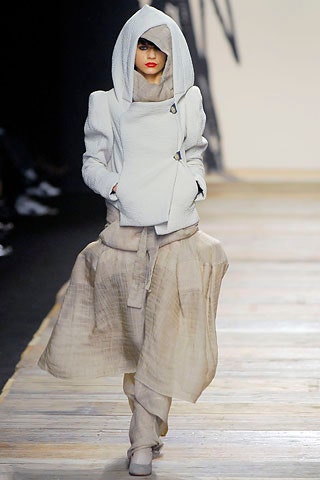 white fitted coat and beige layered dress