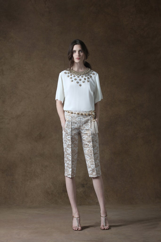 white beaded top with printed pants