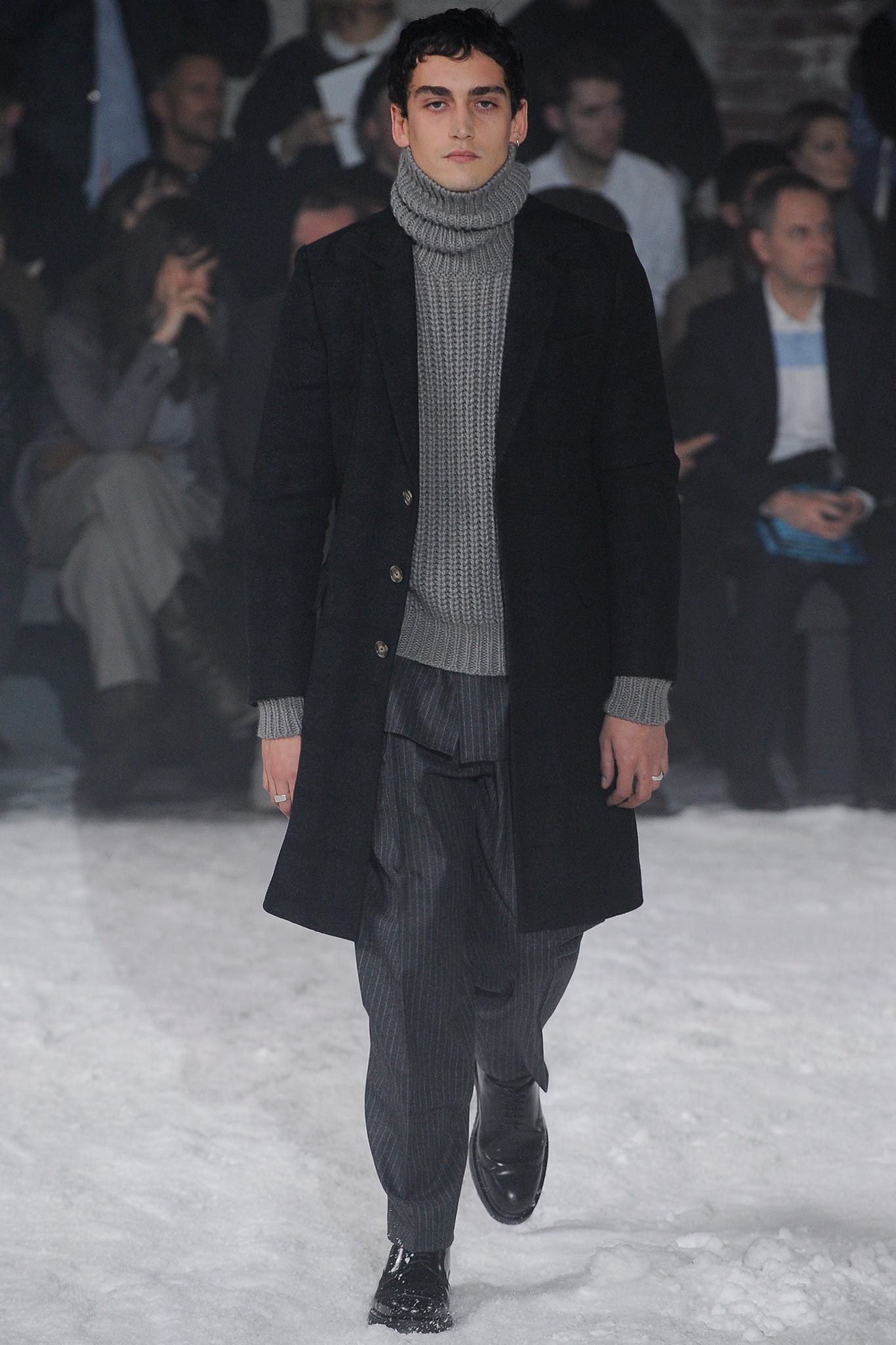 black wool coat gray sweater pants