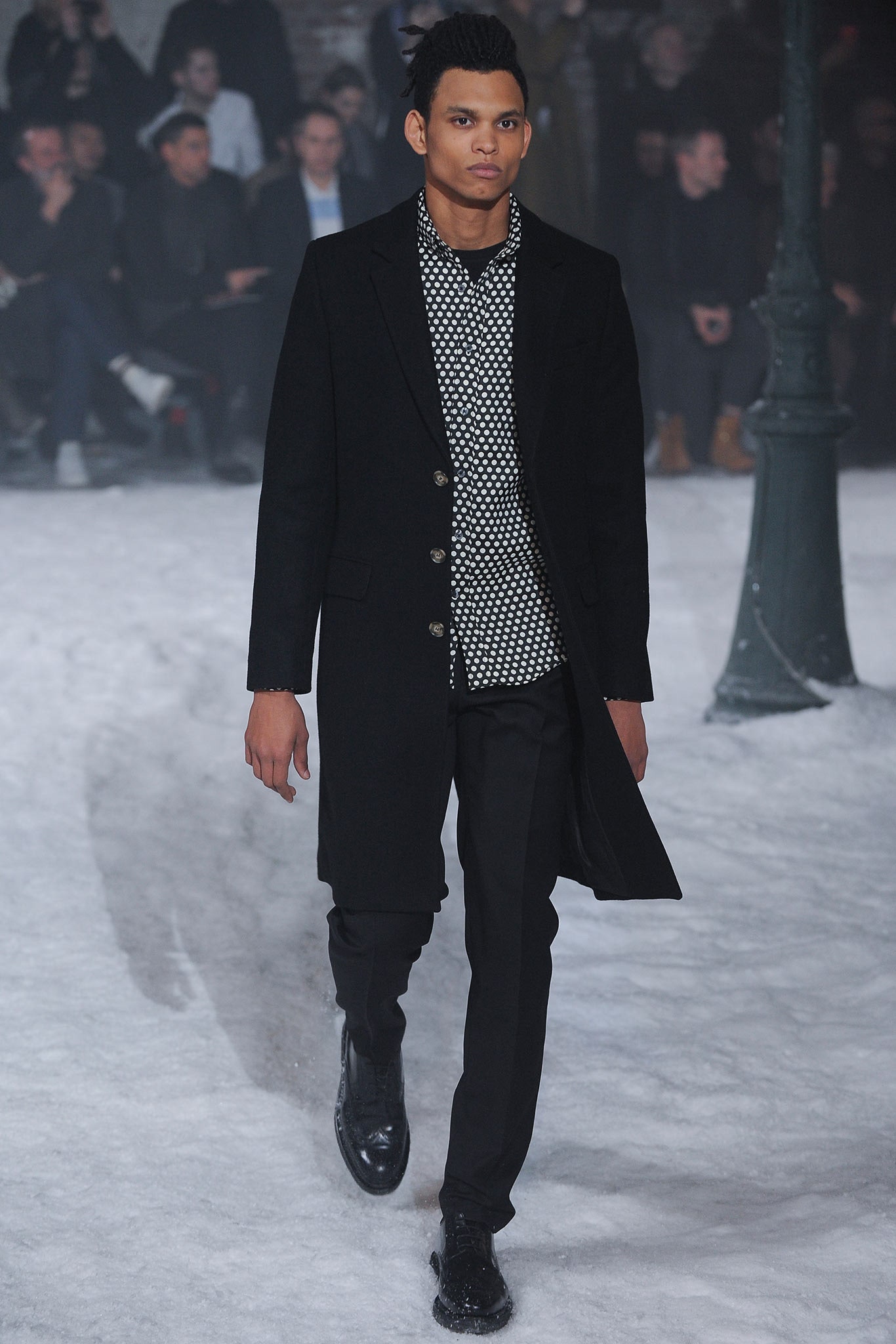 black coat with polka-dot shirt