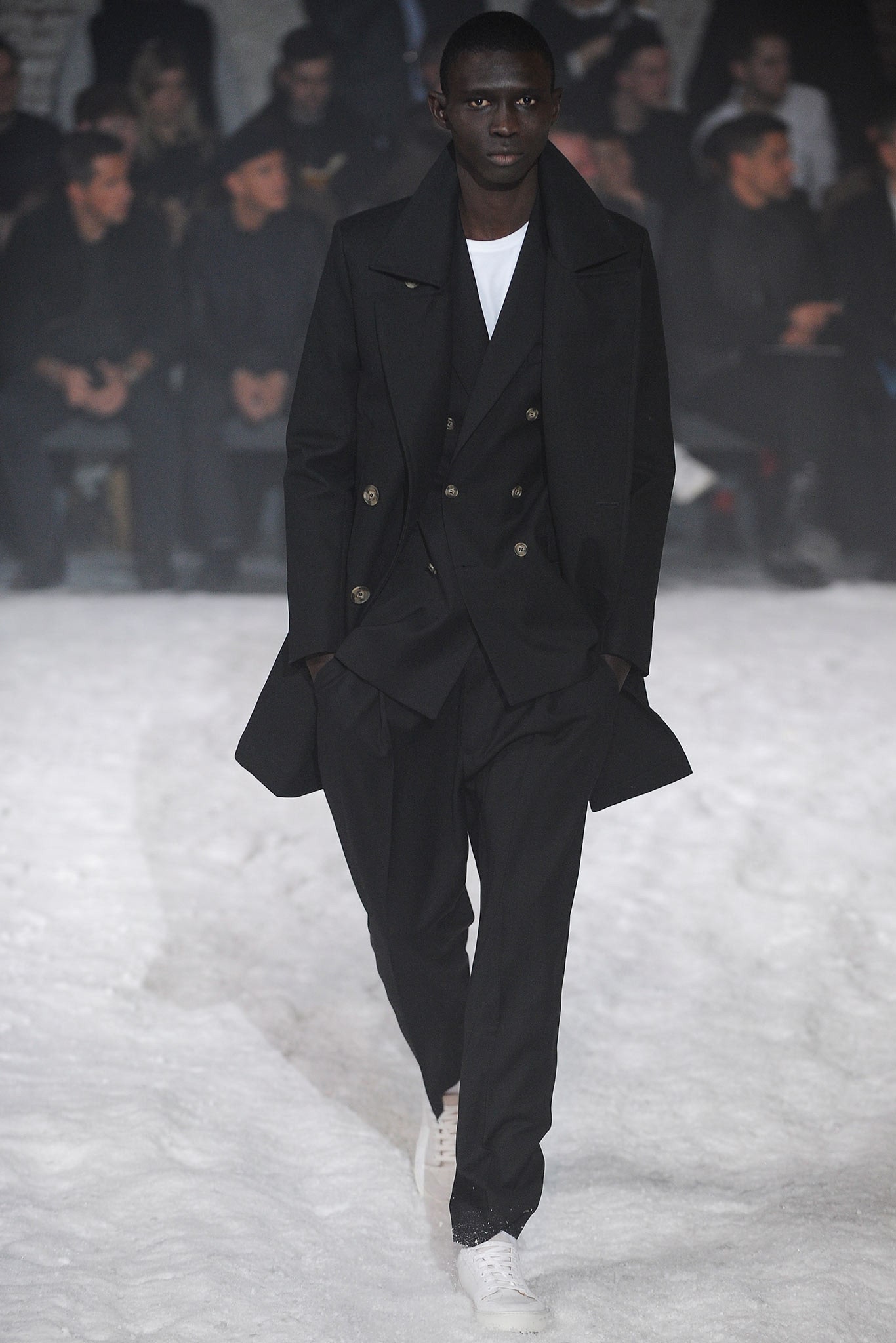 black tailored coat and suit