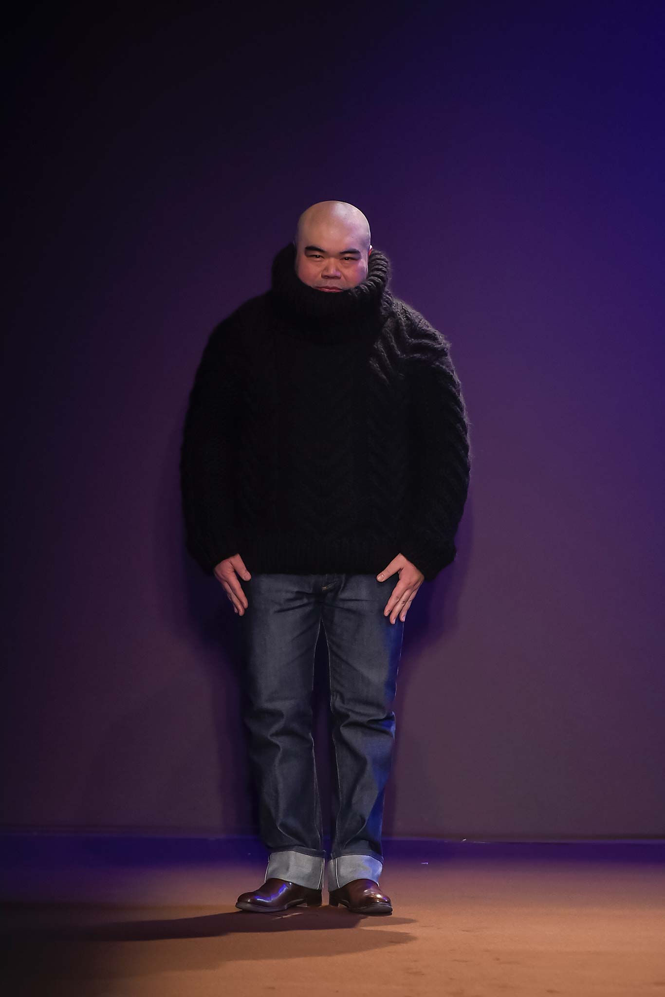 black wool relaxed sweater and blue jeans