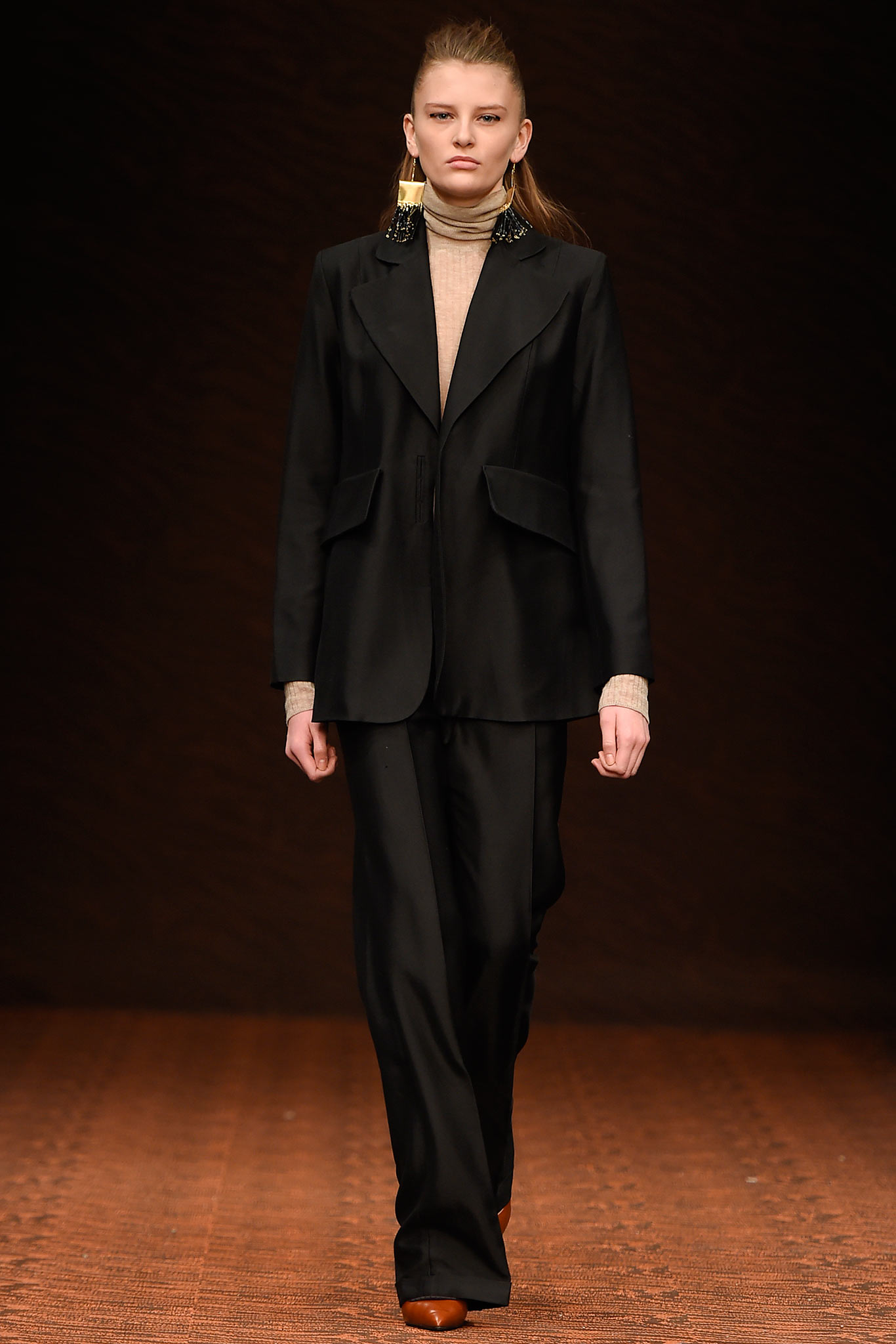 black tailored suit with beige top