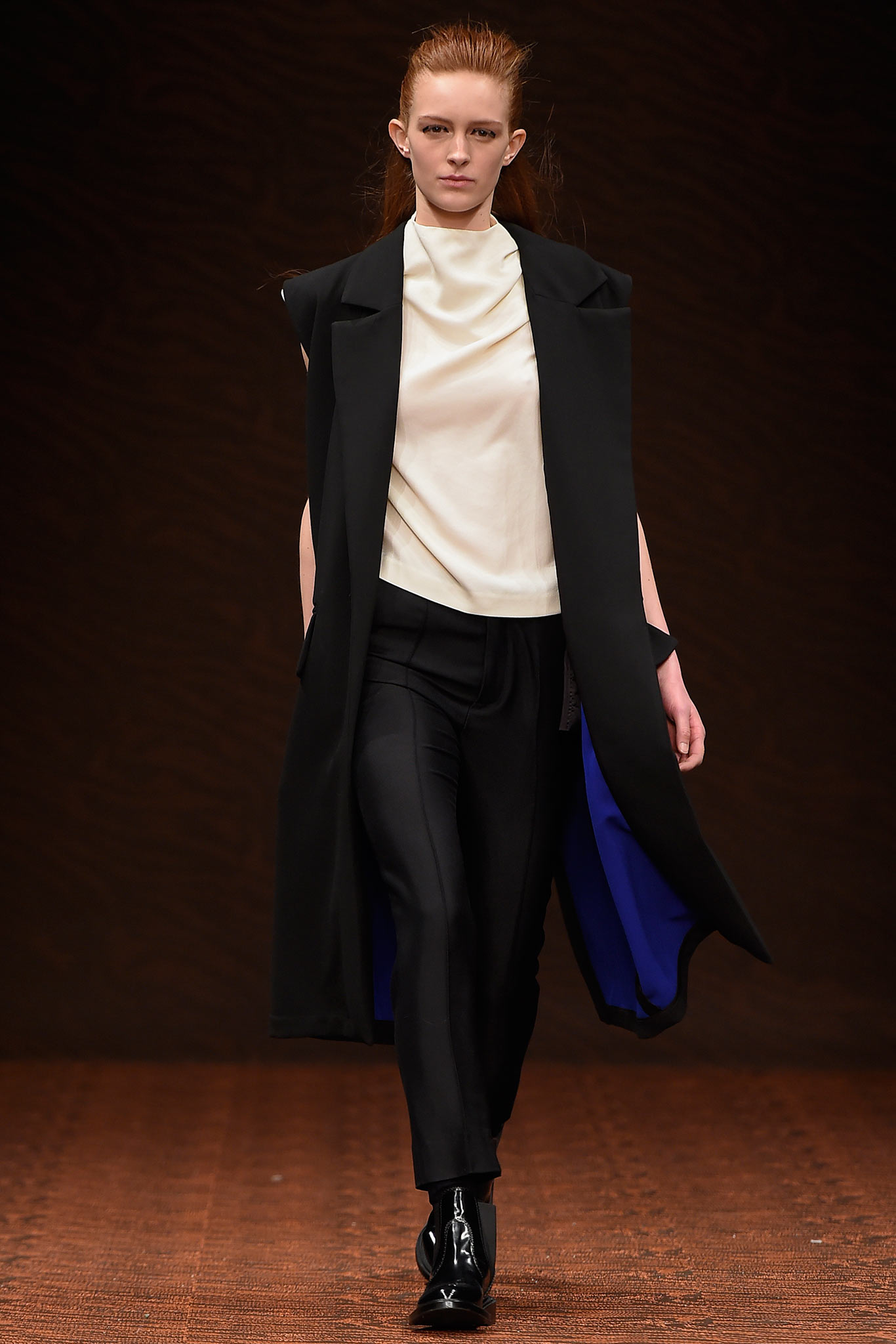 black coat white top black pants