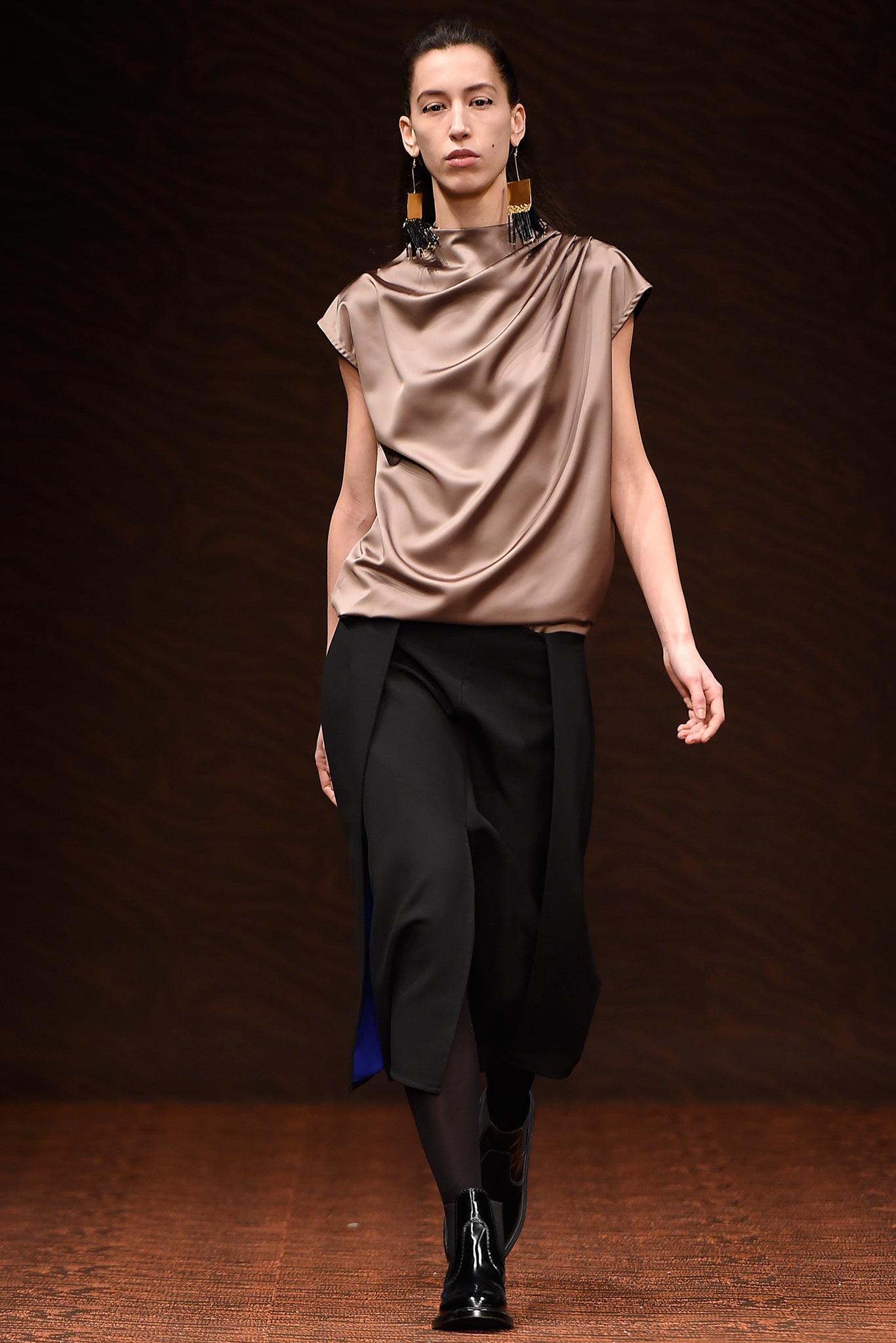 brown silk draped top with black pants