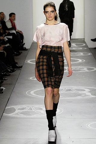 pink silk top with checked skirt
