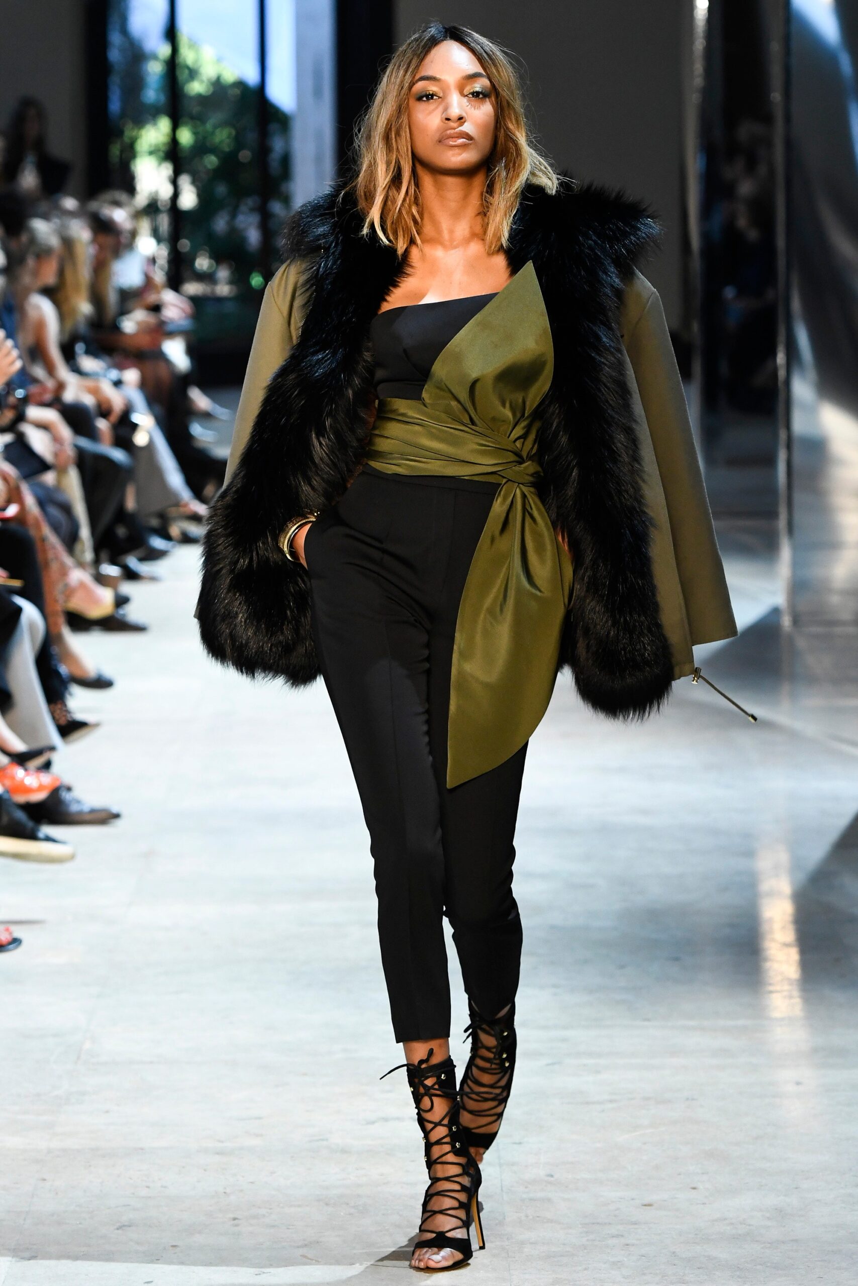 black and green cape with fitted pants