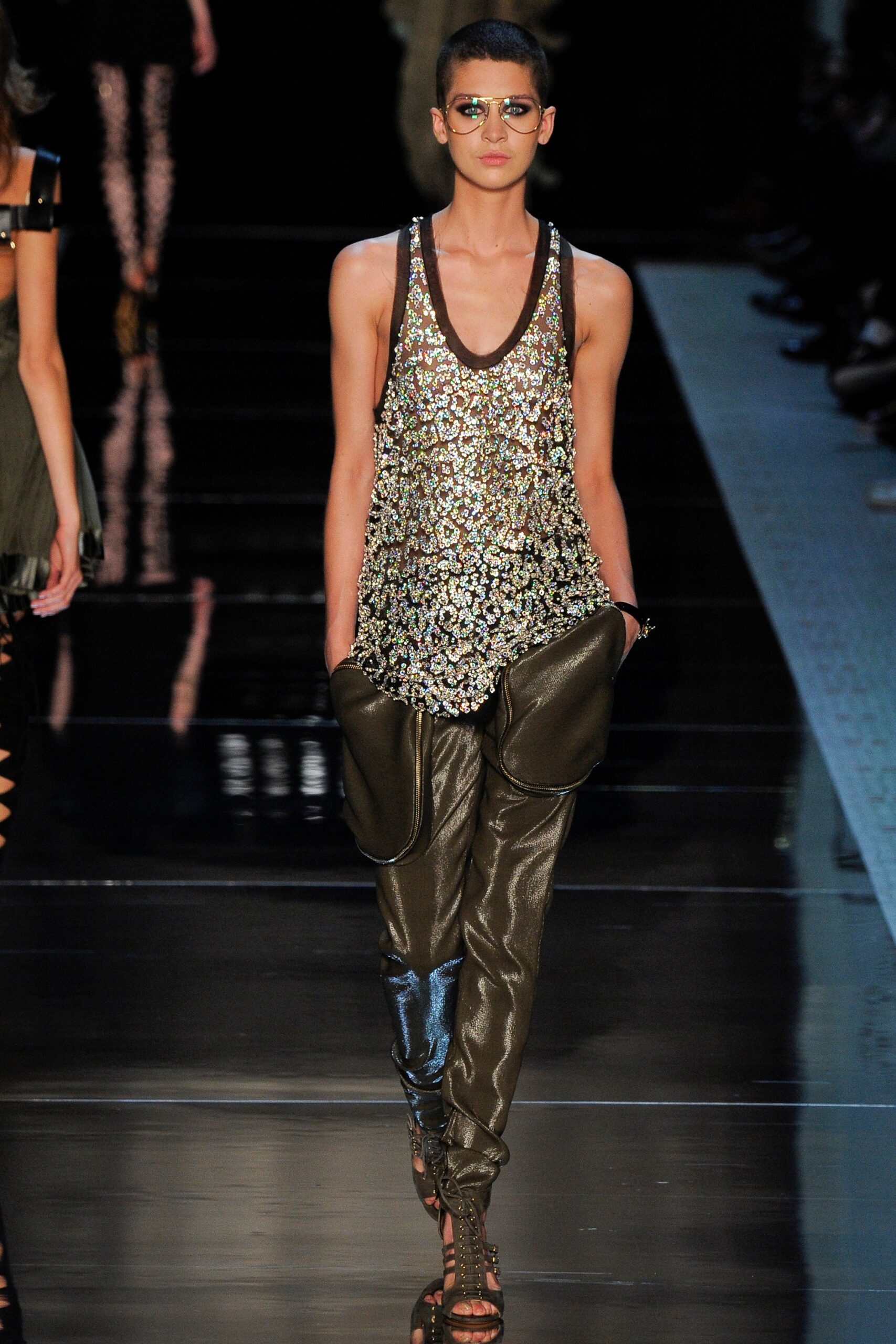 gold sequined sleeveless top with leather pants